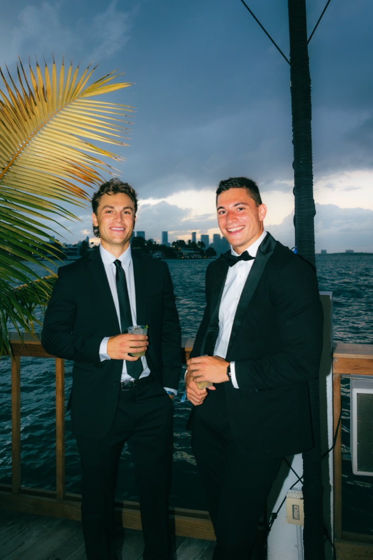 Two founders on the water at dusk
