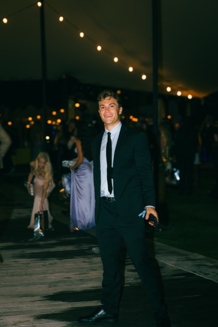 Walking in under the string lights